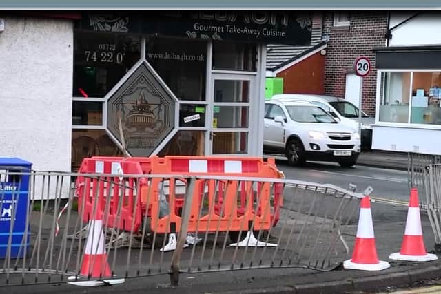 A car crashed through metal railings and knocked down a lamp post in Liverpool Road this morning.