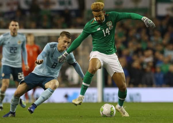 Republic of Ireland's Callum Robinson shields the ball from Northern Ireland's Steven Davis