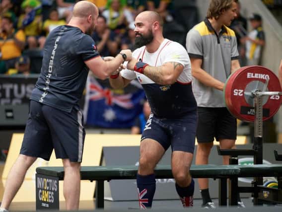 Jonny Mitchell competing in powerlifting