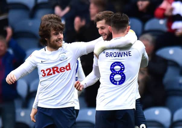 Ben Pearson (left) and Alan Browne congratulate Tom Barkhuizen after his goal against Blackburn