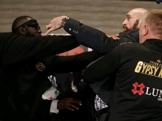 Tyson Fury and Deontay Wilder clash at the press conference ahead of their WBC heavyweight title clash