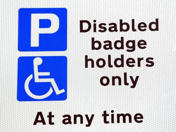 Disabled parking sign as thefts of parking permits for disabled motorists have increased by 45% in the past 12 months, figures show. Photo credit: Jonathan Brady/PA Wire