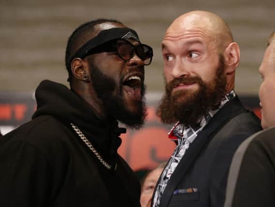 Deontay Wilder and Tyson Fury (right) clash ahead of their world title showdown