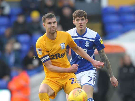 Preston skipper Paul Huntington gets to the ball ahead of Birmingham's Connor Mahoney