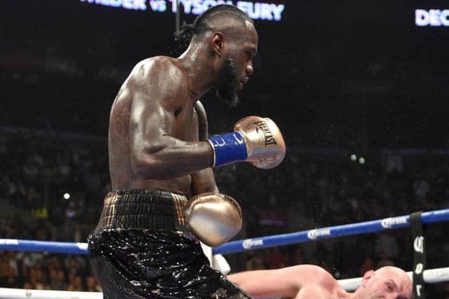 Deontay Wilder send Tyson Fury to the canvas in the final round