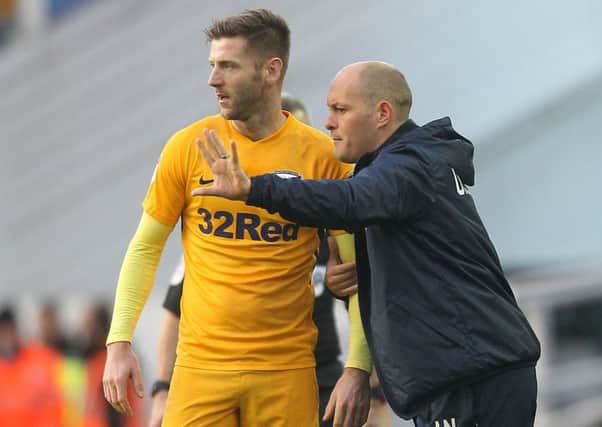 Preston North End manager Alex Neil offers instructions to Paul Gallagher