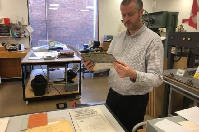Archivist James Towe looks through the documents to be used in an exhibition to mark the M6s 60th birthday