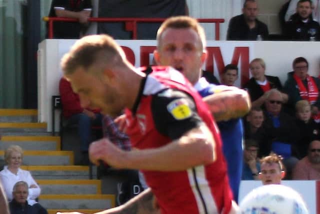 Morecambe defender Steve Old is comfortable in switching from a back four to a three when required