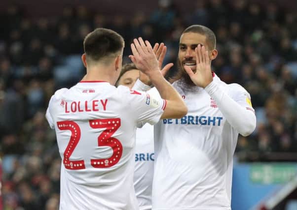 Lewis Grabban (right) celebrates scoring with Joe Lolley in the 5-5 draw at Aston Villa