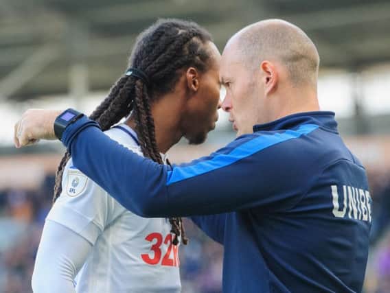 Preston midfielder Daniel Johnson gets instructions from Alex Neil