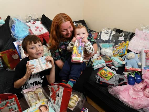 Kirsty Davis and baby Isaac and Brogan, 8, making Christmas gifts for children on neonatal unit at RPH