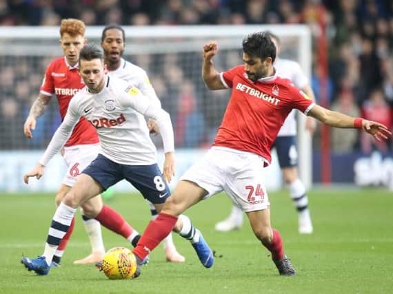 Alan Browne battles with Claudio Yacob at the City Ground