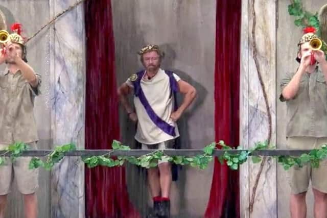"All hail the emperor." Noel made a dramatic entrance on a Colosseum-inspired balcony overlooking them in the pouring rain. "Hail! Literally, and rain," he said.
