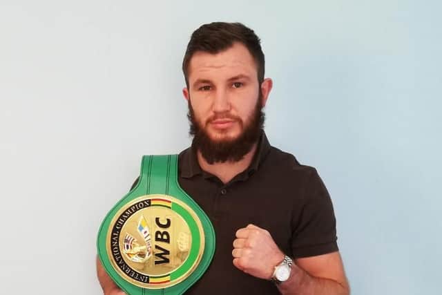 Isaac Lowe with his WBC International featherweight title