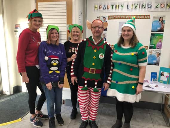 Staff at Cottam Lane Pharmacy dress up as elves for Alzheimer's Society