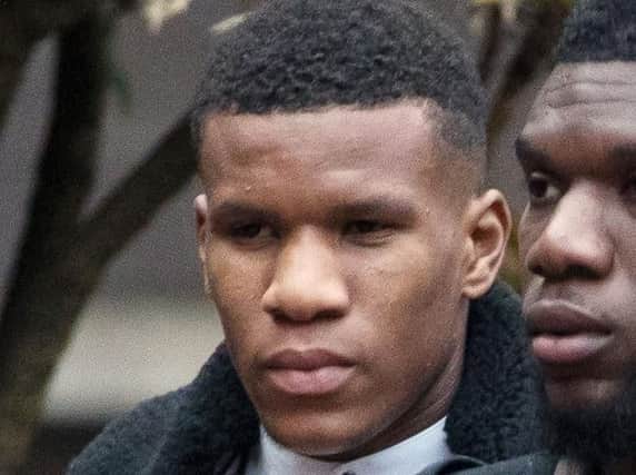 Former England Under-17s footballer Riccardo Calder, 22, (left) arrives at Birmingham Crown Court, where he was jailed for nine months following a road rage attack on a female friend after she accidentally crashed into his car. Photo credit: Aaron Chown/PA Wire