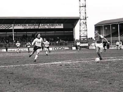 John Kelly chases the ball against Millwall