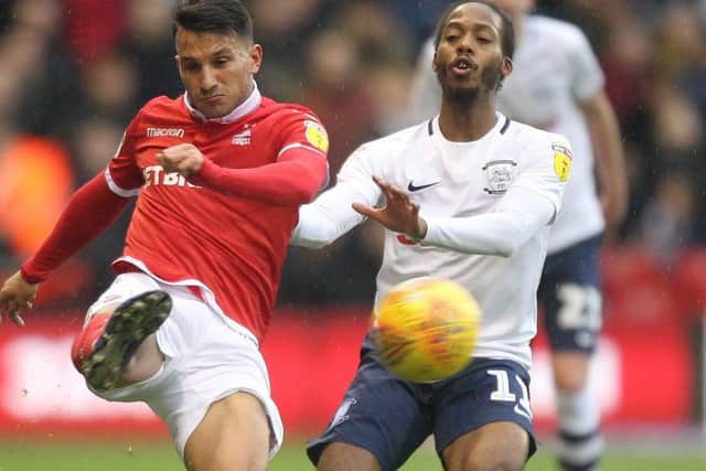 Daniel Johnson battles with  Nottingham Forest's Joao Carvalho