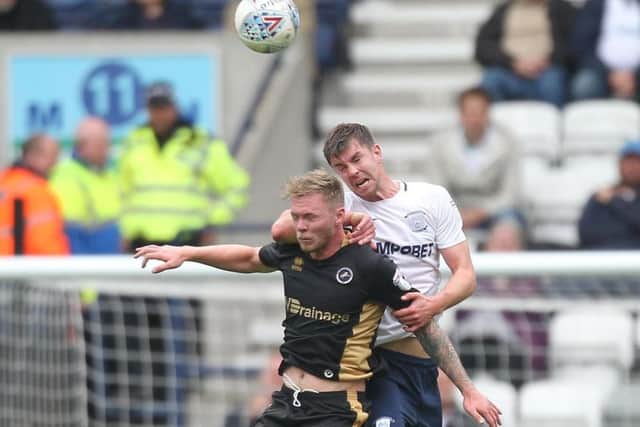 Paul Huntington battles with Aiden O'Brien during last year's meeting between PNE and Millwall at Deepdale