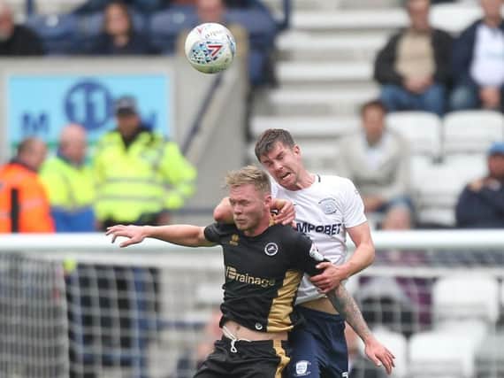 Paul Huntington battles with Aiden O'Brien during last year's meeting between PNE and Millwall at Deepdale