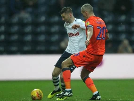 Paul Gallgher comes under pressure from Steve Morison at Deepdale on Saturday