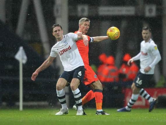 Ben Davies in the thick of the action against Millwall