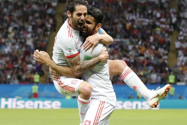 Spain's Diego Costa, right, celebrate after scoring his side's opening goal with Spain's Isco