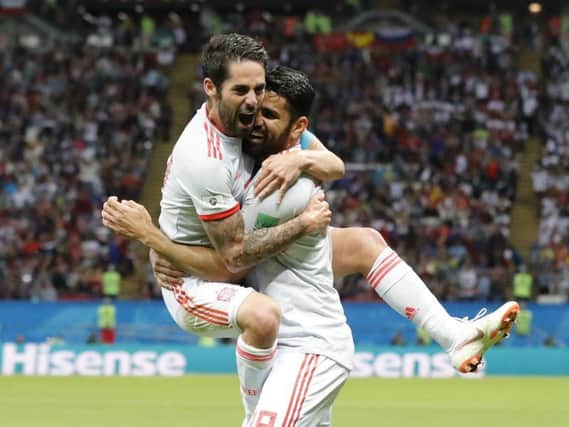 Spain's Diego Costa, right, celebrate after scoring his side's opening goal with Spain's Isco