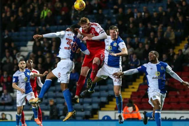 Fleetwood Town's Baily Cargill beats Blackburn Rovers' Joe Nuttall in the air