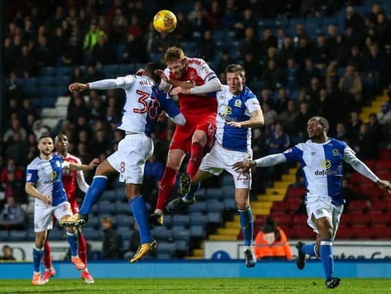 Fleetwood Town's Baily Cargill beats Blackburn Rovers' Joe Nuttall in the air