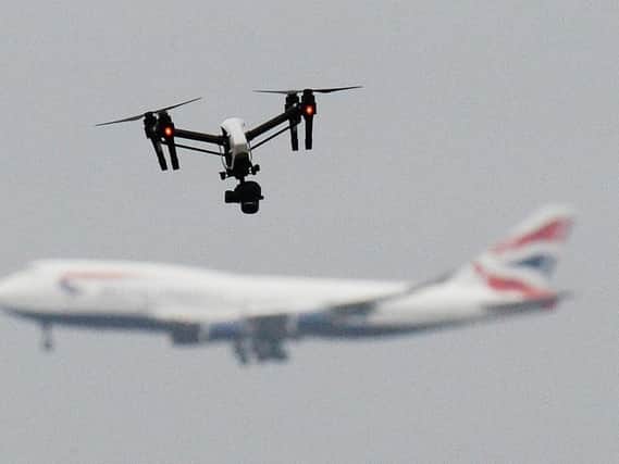 A drone and an aircraft. Gatwick airport remains closed this morning after drones were spotted over the airfield last night and this morning