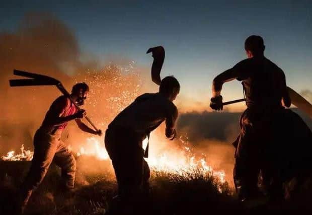 Lancashire firefighters battle the Winter Hill moorland blaze, July 2018.