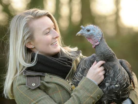 Hayley with family pet Thelma the turkey.