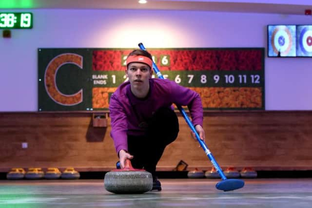 Instructor Peter Walton curling