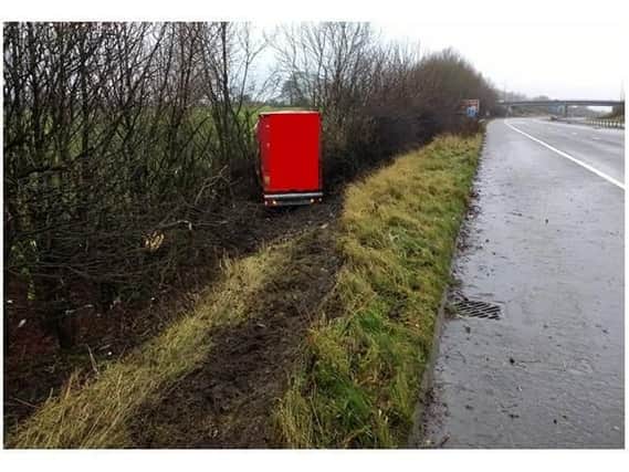 The lorry ploughed through the central reservation and ended up in a hedge. Photo: Highways England