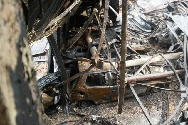 As up to 100 firefighters battled the flames a series of explosions - from petrol in the cars' fuel tanks - could be heard