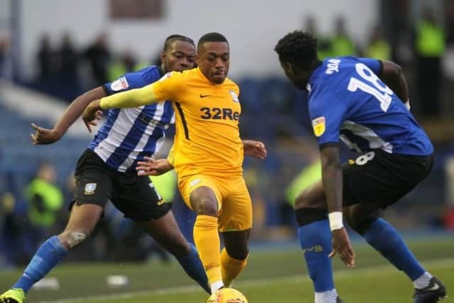 Preston right-back Darnell Fisher takes on Sheffield Wednesday attacker Lucas Joao