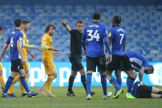 Ben Pearson is sent off by referee David Coote