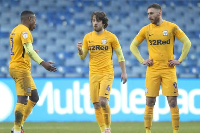 Ben Pearson is sent-off against Sheffield Wednesday s Darnell Fisher and Louis Moult look on