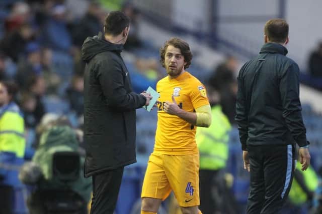 Ben Pearson has a word with the fourth official after his red card