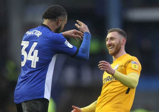 North End's Louis Moult and Sheffield Wednesday's Michael Hector exchange season's greetings