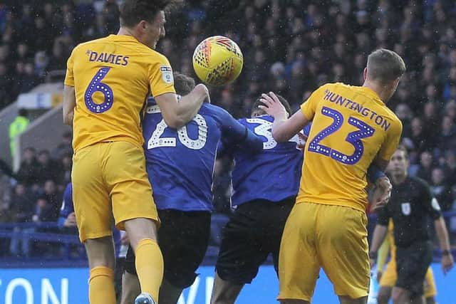 Ben Davies wins a header in PNE's defeat at Sheffield Wednesday