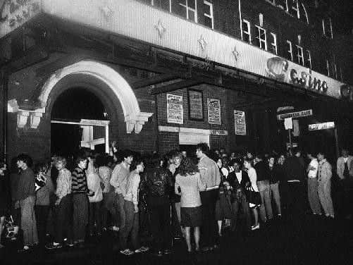 Revellers queing outside the famous Empress Ballroom, better known as the Wigan Casino