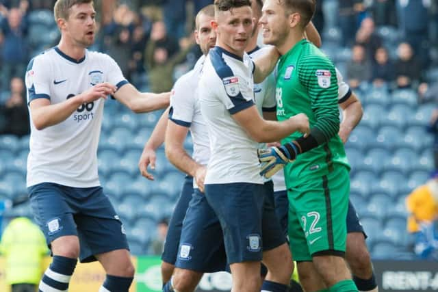 Preston goalkeeper Chris Maxwell is congratulated after saving a penalty against Aston Villa