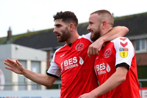 Fleetwood Town's Paddy Madden celebrates scoring his side's first goal with Ched Evans