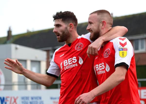 Fleetwood Town's Paddy Madden celebrates scoring his side's first goal with Ched Evans
