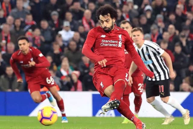 Liverpool's Mohamed Salah scores the second goal of the game from the penalty spot against Newcastle