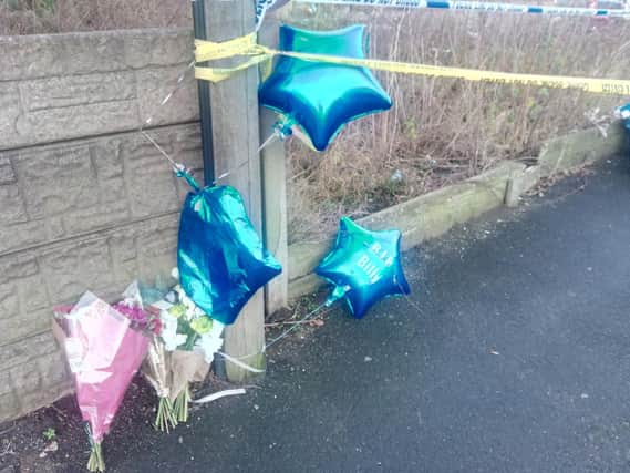 Flowers and balloons left on Bickershaw Lane