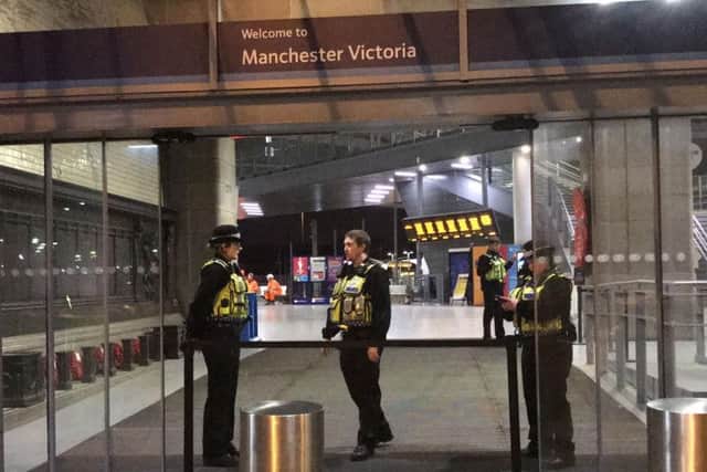 Police at Victoria Station in Manchester last night