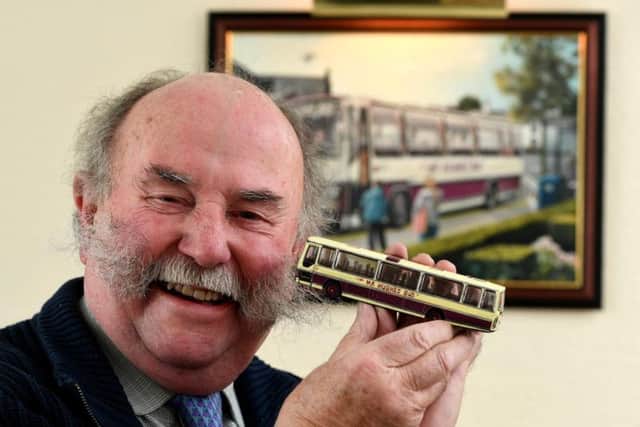 Michael also has a small model version of his bus to accompany the painting